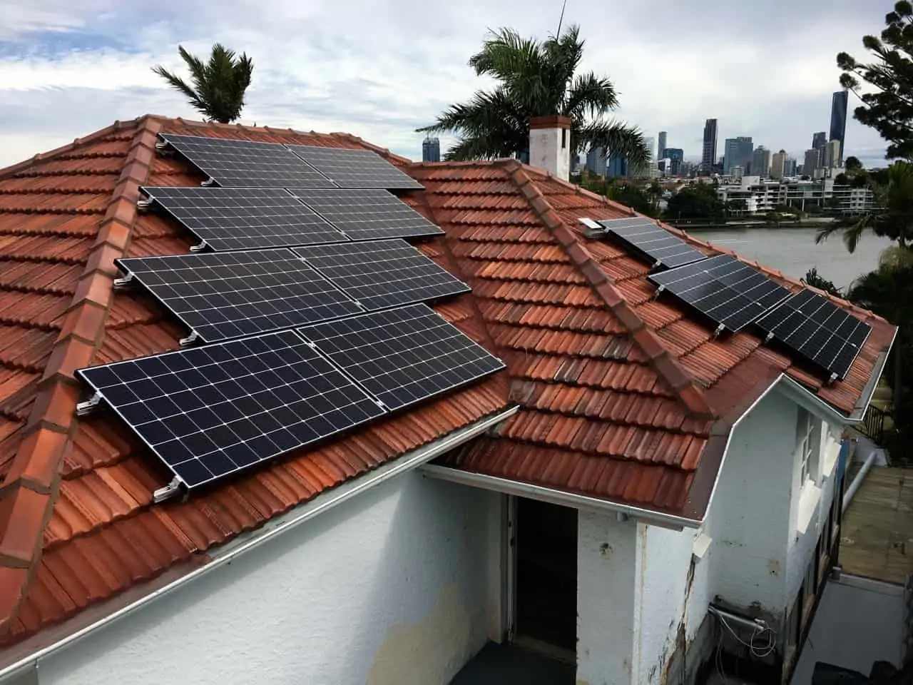 Dark solar cells on a red roof