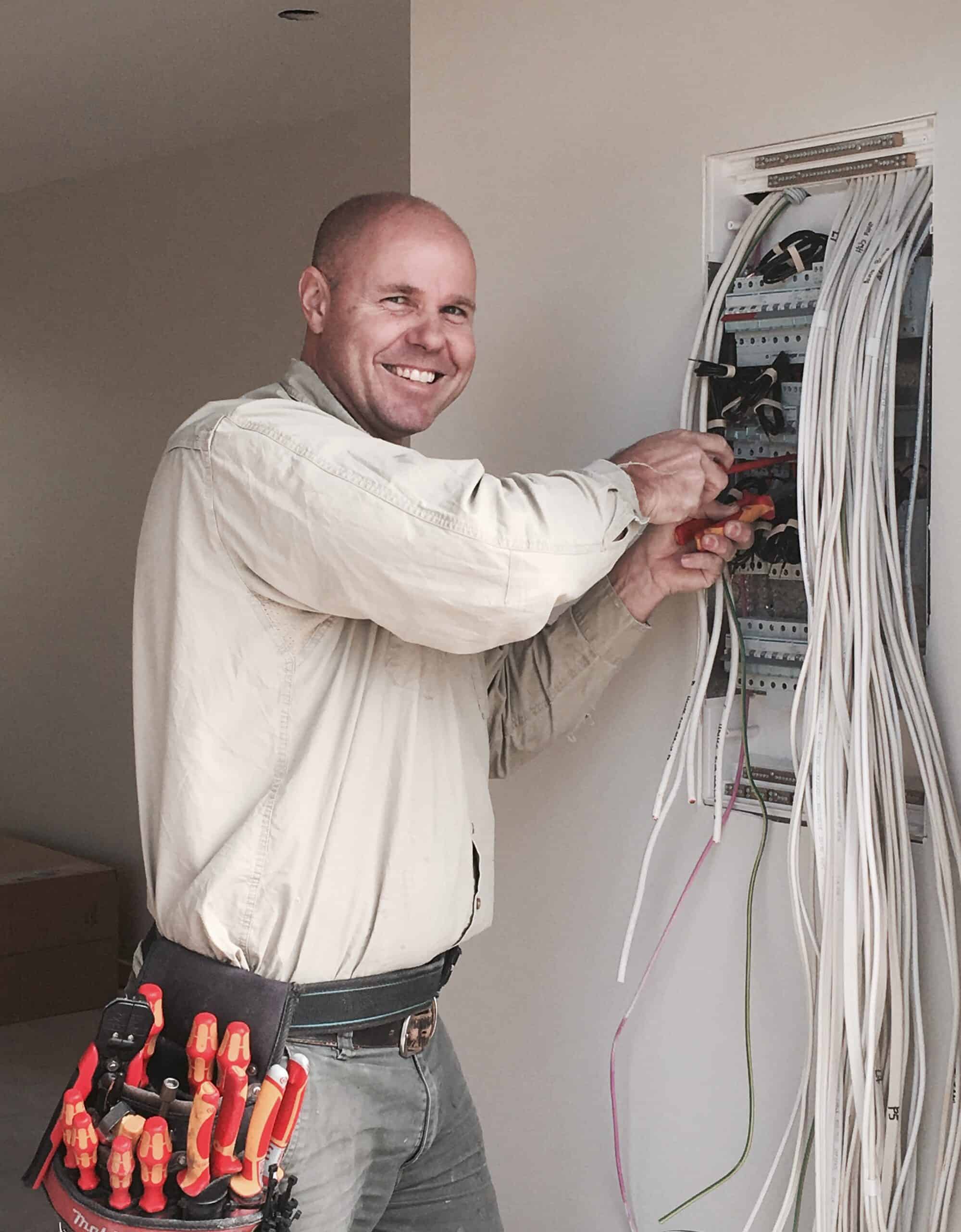 3D Energy's Director Matthew Giddins wiring up a switchboard