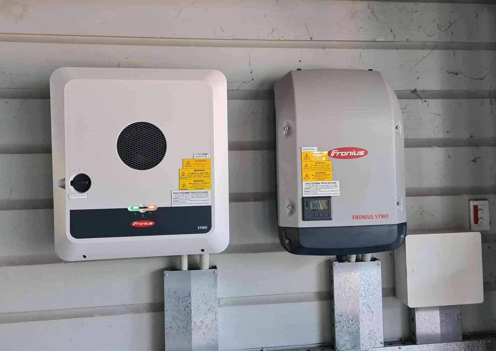 solar system battery installed against home's panelling on the wall
