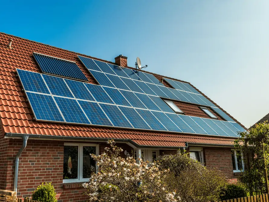 Solar panels on the red roof of a home