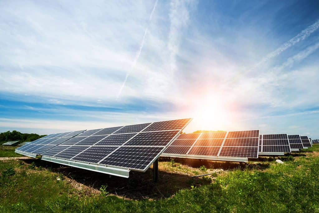 Solar panels in a sunny field